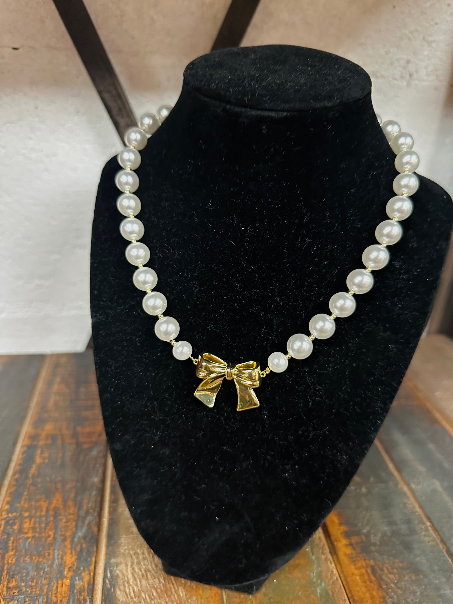 Gold Bow and Pearl Necklace