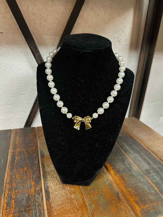 Gold Bow and Pearl Necklace